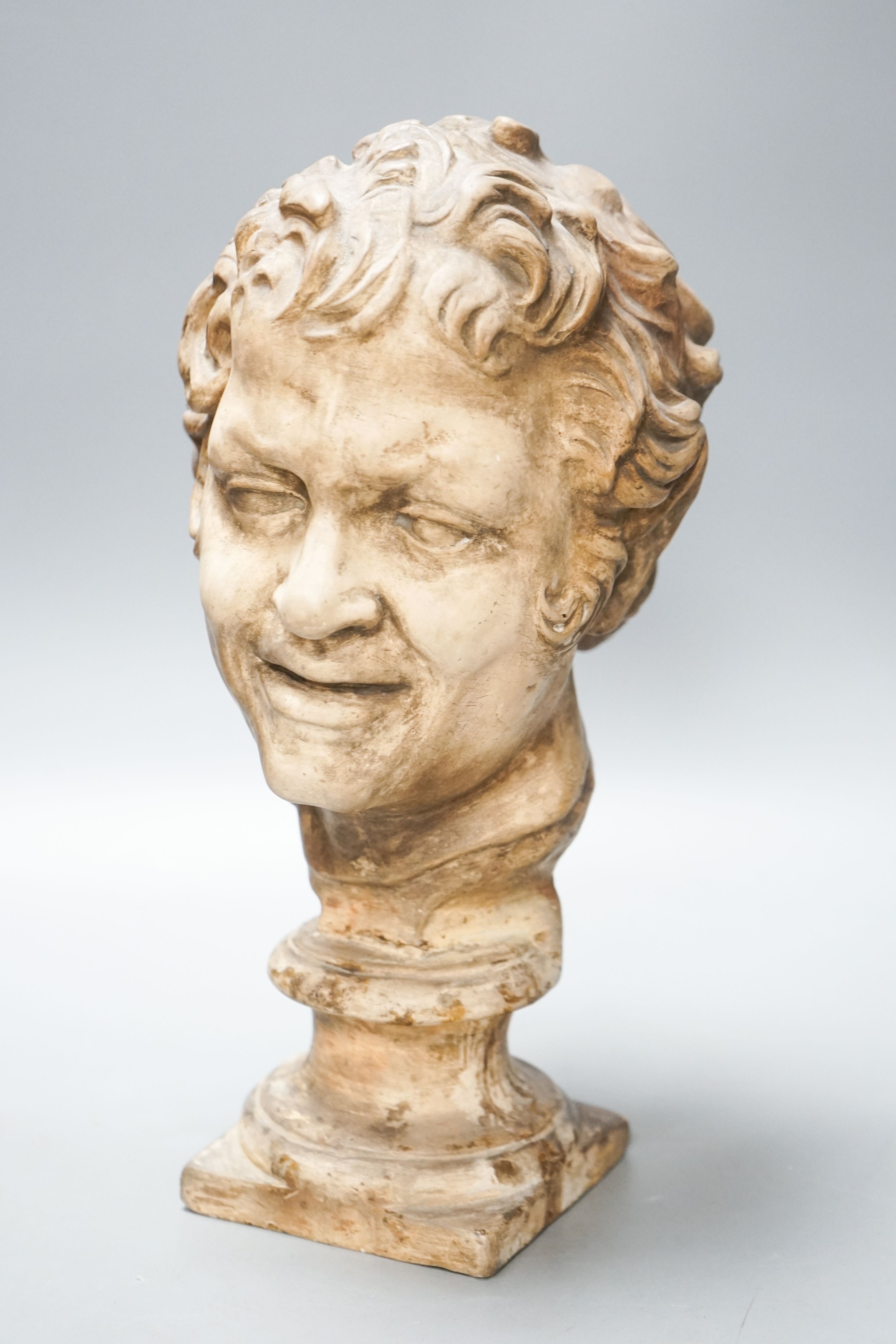 An earthenware bust of a faun, 32cm